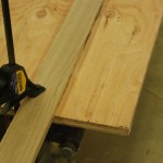 Setting a guide for the router in making the lap joint