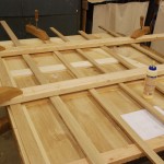 Glueing the framework in the galley area.