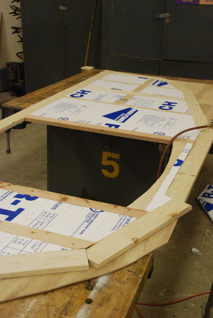 Insulation The insulation is cut and fit into place. It doesn't need any glue as the fit is tight and it will be enclosed by the interior plywood.