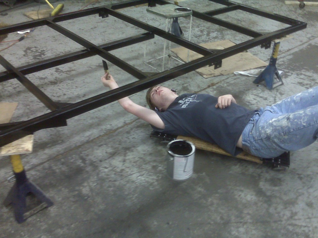 Painting the Chassis Keith putting the first coat of paint on the chassis.