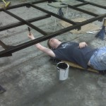 Keith putting the first coat of paint on the chassis.