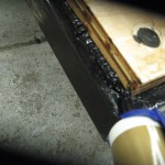 Laying a bead of Silicone II roofing caulk